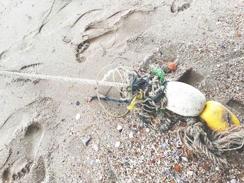 High angle view of garbage on sand