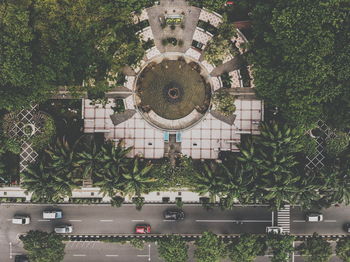 High angle view of building and trees in city