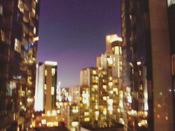 Buildings in city at night