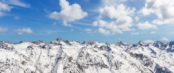 Panorama of winter snowy mountains in caucasus region, russia