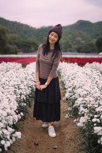 Young woman standing on field