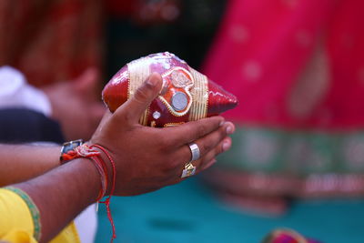 Close-up of woman holding red umbrella