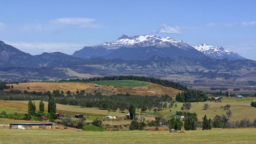 Scenic view of landscape and mountains against sky