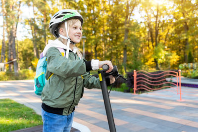 Full length of boy standing in park