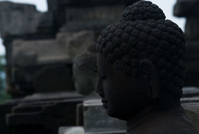 Close-up of buddha statue at borobudur temple