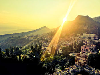 Aerial view of townscape against sky during sunset