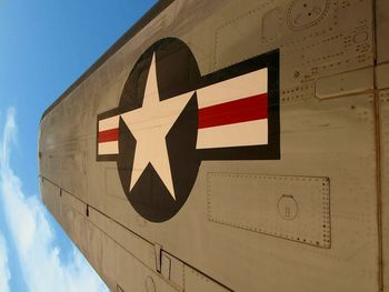 Close-up of symbol on aircraft wing against sky at pima air and space museum