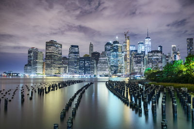 Manhattan glows across east river nyc