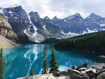 Scenic view of lake and mountains against sky