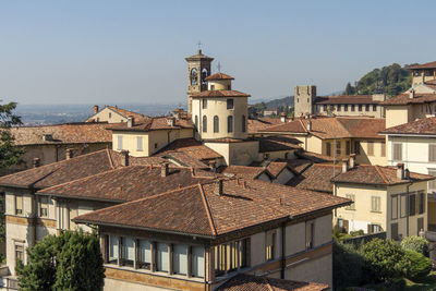 Roofs and towers on the skyline of the old city of bergamo, italy