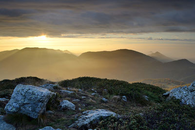 Scenic view of mountains against sky during sunset