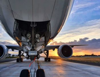 Towing of boeing 777-300er during sunrise.