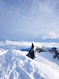 Scenic view of snowcapped mountain against sky