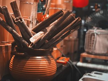 Close-up of cinnamon sticks in container at store