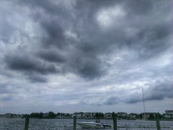 Scenic view of sea against cloudy sky