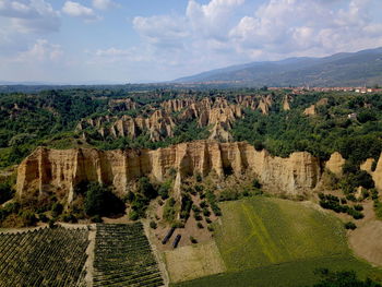 Panoramic view of landscape against cloudy sky