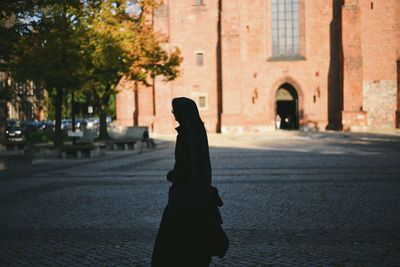 Woman walking in city