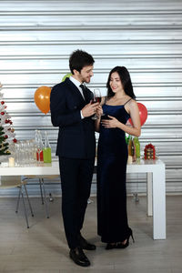Young couple standing on glass