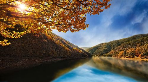 Scenic view of lake against sky during autumn