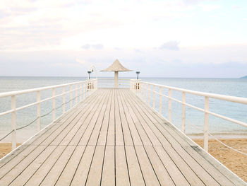 Pier over sea against sky