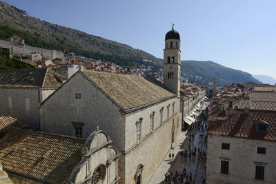 Buildings in town against sky