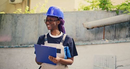 Portrait of engineer working at construction site