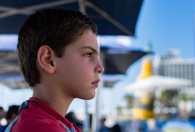 Profile view of boy at beach