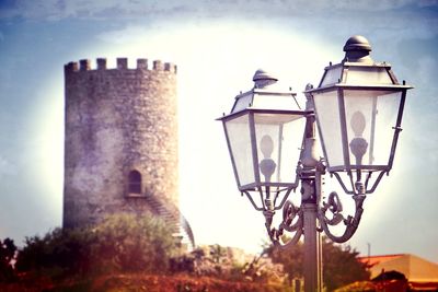 Low angle view of street light against building