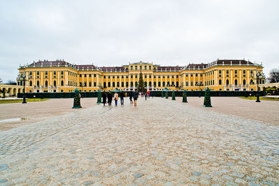 Group of people in front of historical building