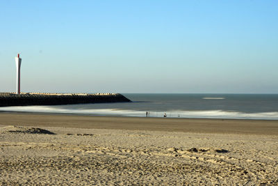 Scenic view of beach against clear sky