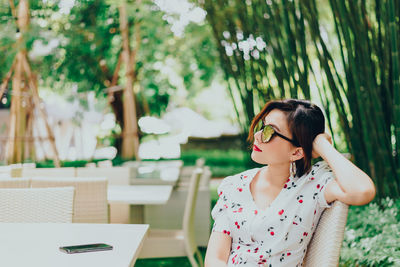 Woman sitting at outdoor restaurant