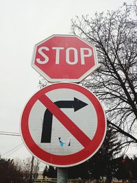 Information sign on road against sky