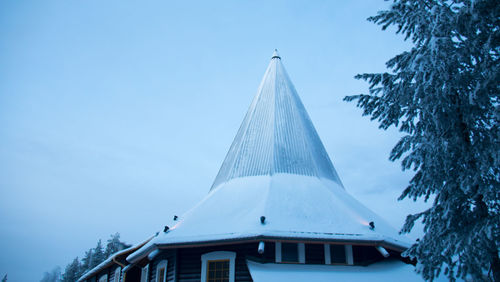 Traditional windmill against blue sky