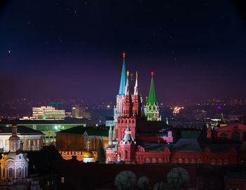 Illuminated buildings in city at night