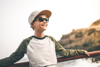 Portrait of smiling young man wearing sunglasses