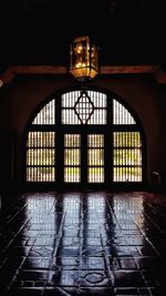 Illuminated building seen through glass window