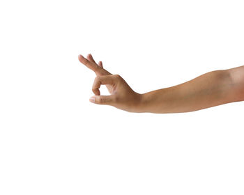 Close-up of human hand against white background