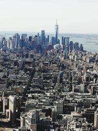 Aerial view of modern buildings against clear sky