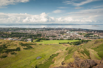 Scenic view of landscape and cityscape against sky