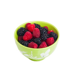 High angle view of strawberries in bowl against white background