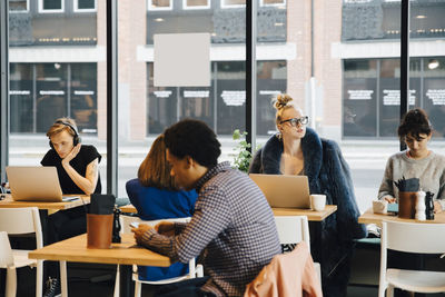 Group of people sitting on table