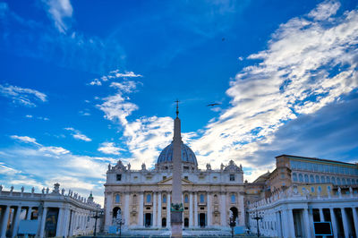 Low angle view of buildings against blue sky