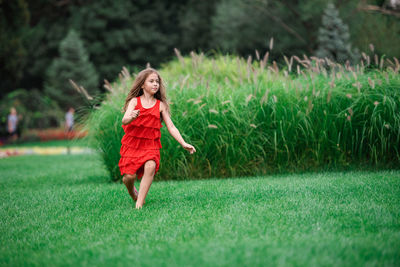 Full length of a woman on field