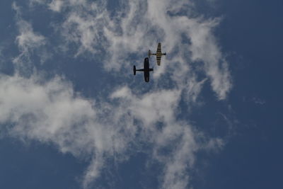 Low angle view of airplane in sky