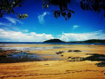 Scenic view of sea against cloudy sky