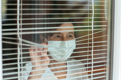 Portrait of a man in a window