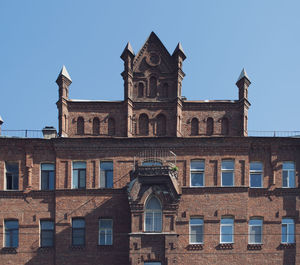 Low angle view of building against clear blue sky