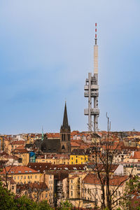 Buildings in city against sky