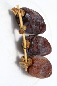 Close-up of fruit against white background