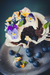 Close-up of multi colored flowers in plate